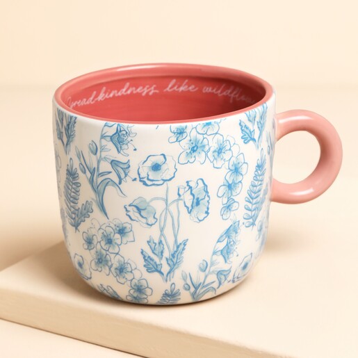 floral blue mug against pale pink background