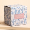 wildflower packaging against pale pink background