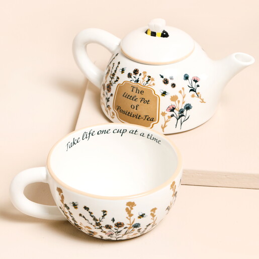 teapot and mug set with floral design