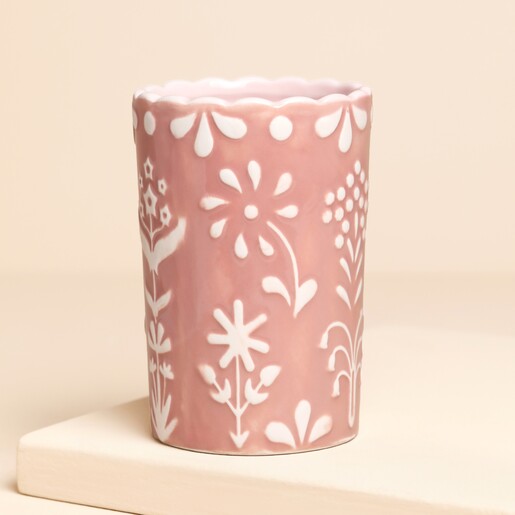 ceramic tumbler with pink and white floral desigb