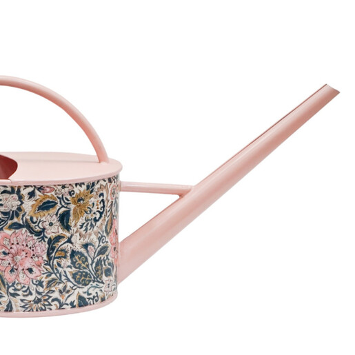 Close Up of the Long Spout on a Pale Pink Metal Watering Can With a Floral Print Outer