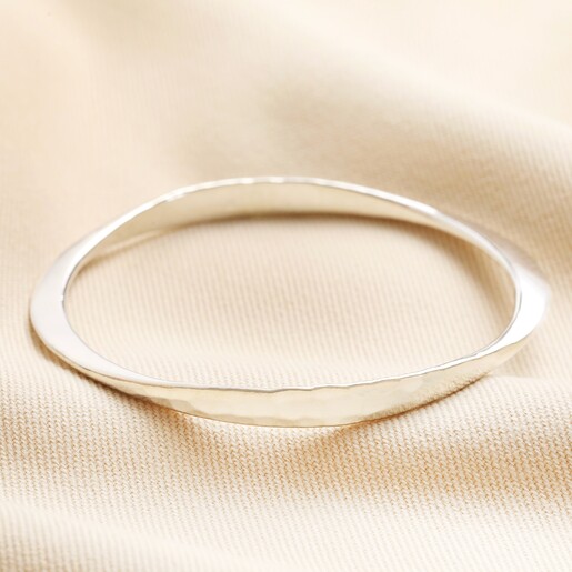 Personalised Hammered Sterling Silver Twisted Bangle against neutral material