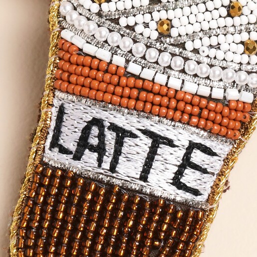 close-up of golden latte design