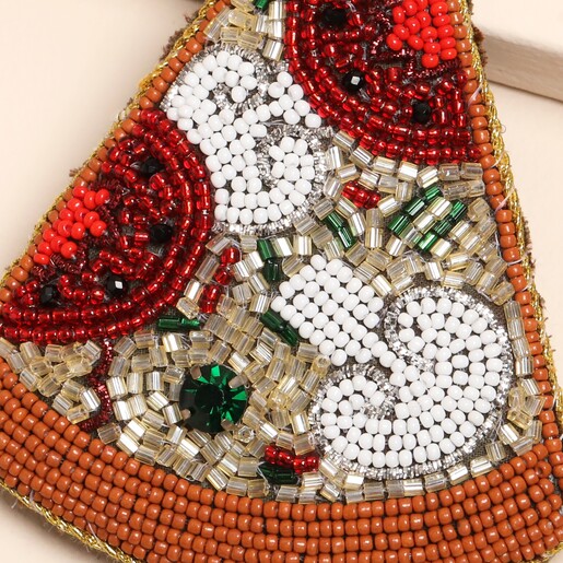 close up of beaded pizza slice design