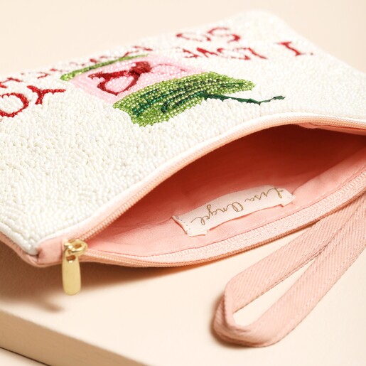 inside shot of pale pink zipper against background