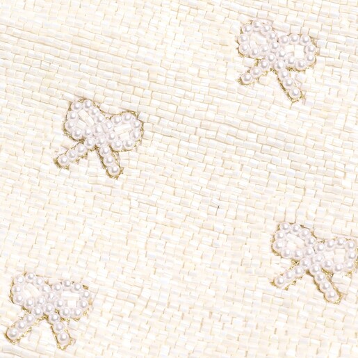 A Close Up Shot of the Pearl Beaded Bow Details on the White Beaded Coin Purse