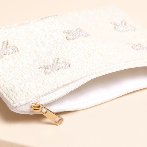 A Close Up of the Pearl Beaded Tassel Zip Pull on the White Beaded Coin Purse