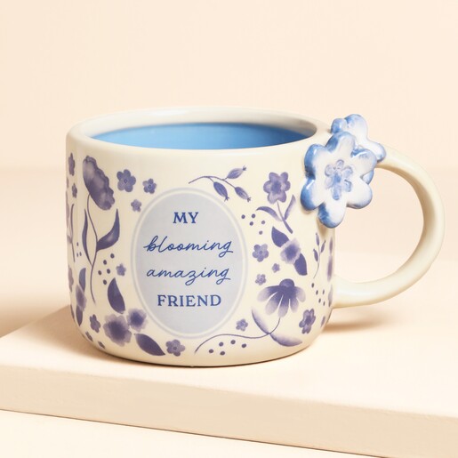 A Cream Ceramic Mug With a Blue Floral Print and a Meaningful Message About Friendship on the Front
