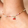 Close Up of a Bright Coloured Beaded Chain Anklet with a Cherry Charm Worn by Model