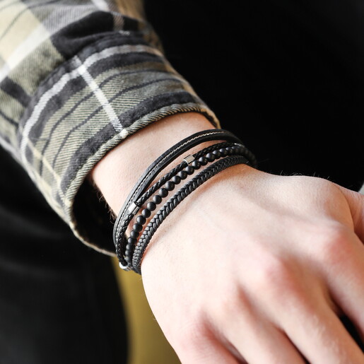 stainless steel spacers on black leather strands