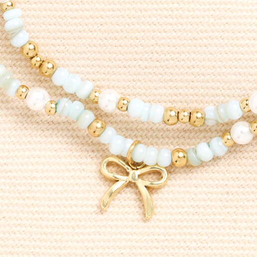 Close Up of Gold Bow Charm on Green and Gold Beaded Wrap Around Bracelet