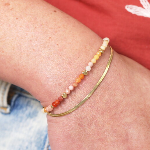 Orange Double Layer Herringbone Bracelet in Gold Close Up On Model