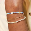 Stainless Steel Blue Beaded Flower Charm Bracelet in Gold
