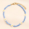 Stainless Steel Blue Beaded Flower Charm Bracelet in Gold