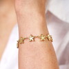starfish chain bracelet in gold close up on model