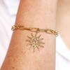 gold celestial bracelet close up on model wrist