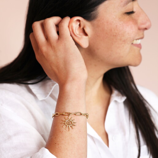 gold celestial bracelet on model wrist