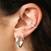 A Sparkly Silver Open Backed Earring With Added Crystals and a Twist Effect