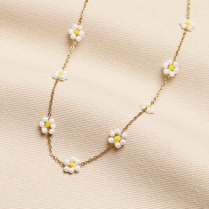 Stainless Steel White Beaded Daisy Charm Necklace in Gold