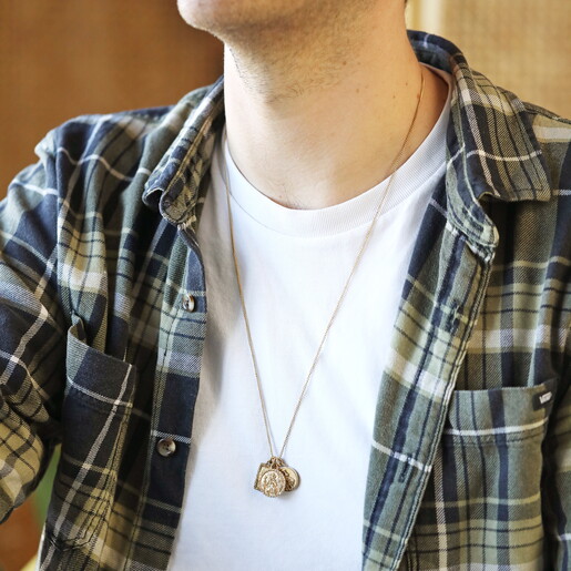 a long chain charm necklace in gold