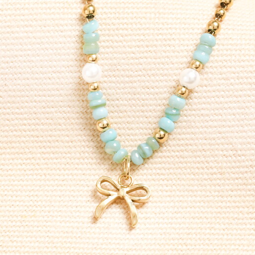 green and gold stainless steel bow charm necklace