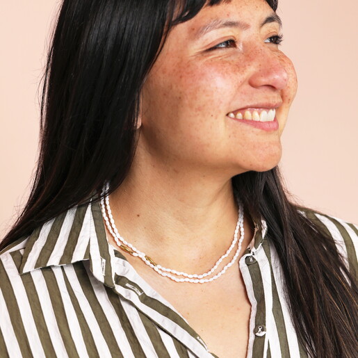 gold beaded necklace on model