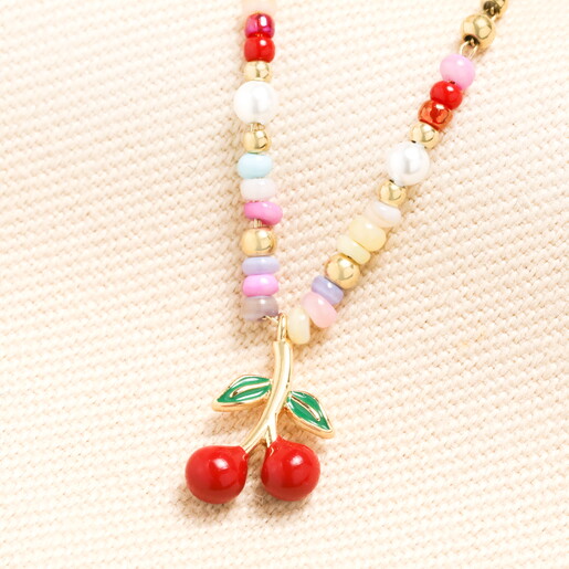A Colourful Beaded Necklace with a Dangling Cherry Charm