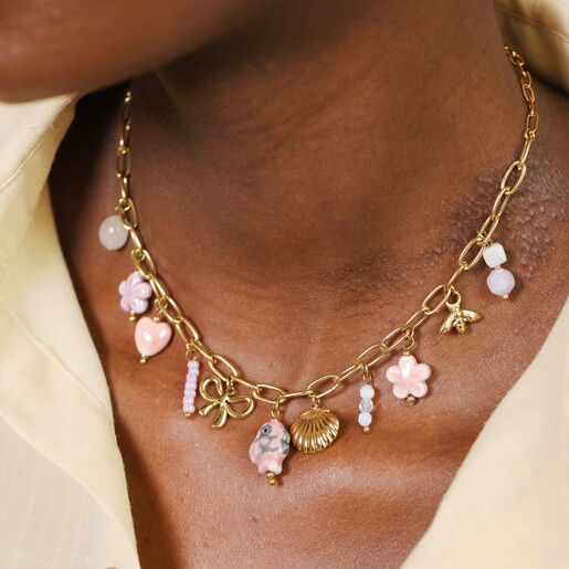 A Chunky Gold Chain Necklace With Dangling Bow Heart Flower Shell Bee and Bead Charms