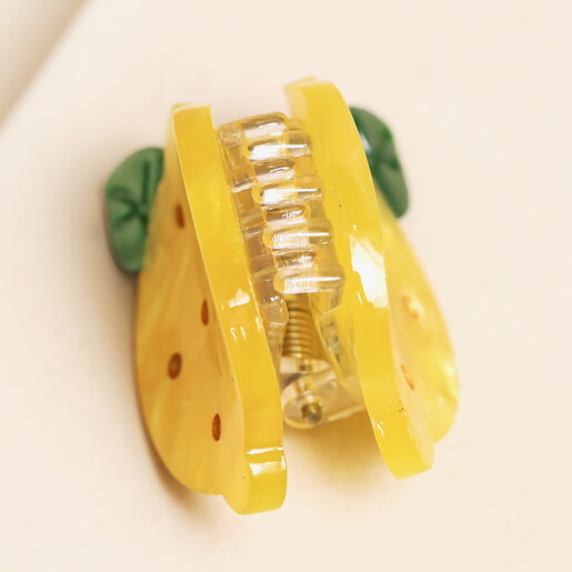 side of mini lemon hair clip against white background