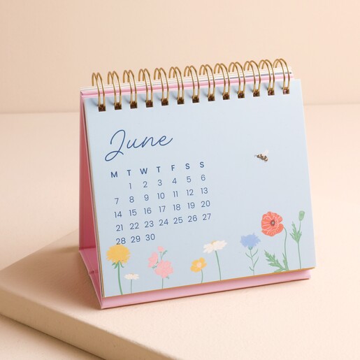 June page of 2027 desk calendar showing dates and colourful wildflower illustrations.