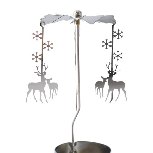 Close-up of the hanging reindeer and snowflake silhouettes on the silver tealight spinner.