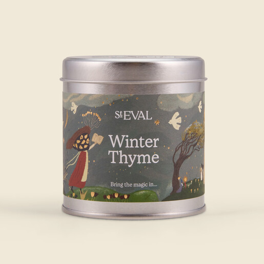 St Eval Winter Thyme tin candle with festive illustrated sleeve and closed lid