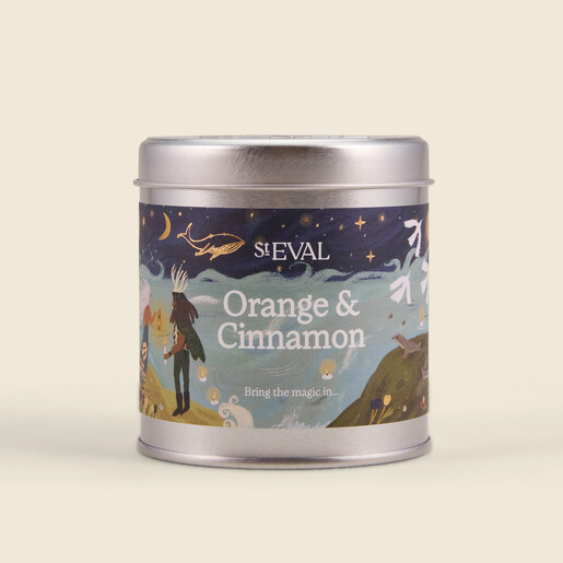 St Eval orange and cinnamon candle in silver tin with lid on
