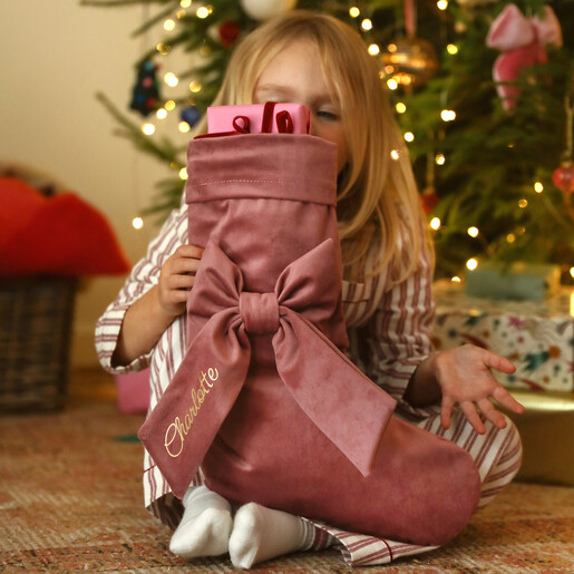 toddler with personalised stocking