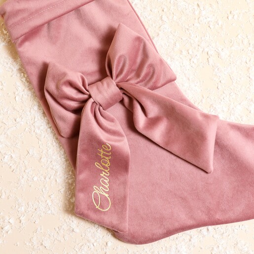 Close up of the pink velvet bow featuring personalised gold name script