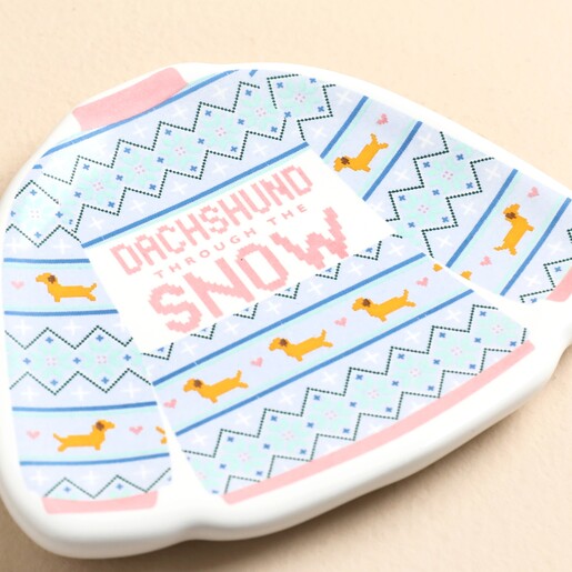 Close-up detail of Dachshund Through The Snow print on ceramic trinket dish