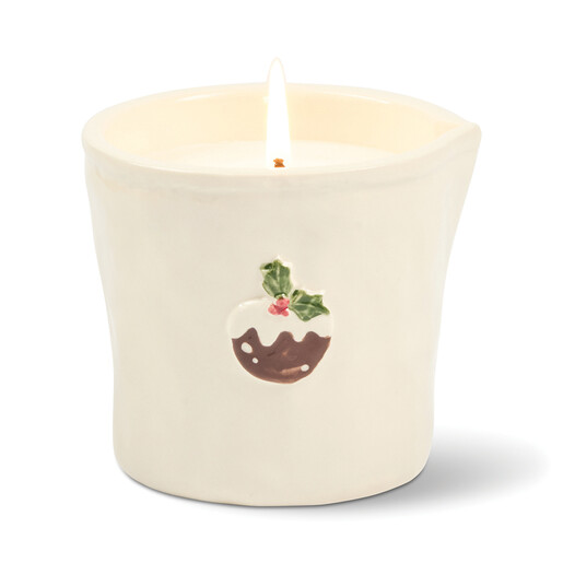 Lit Christmas pudding embossed ceramic candle showing delicate flame and motif detail