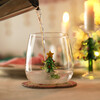 lifestyle shot of green festive figurine