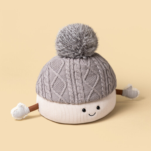 Front view of Jellycat Amuseables Pomilly bobble hat plush toy smiling