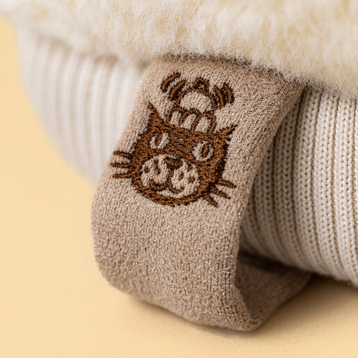 Close-up of the embroidered Jellycat logo label on the soft toy