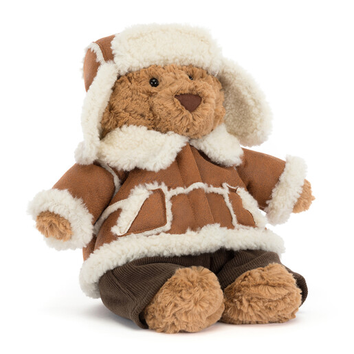 Jellycat Bartholomew Bear soft toy sitting dressed in an alpine winter jacket and hat