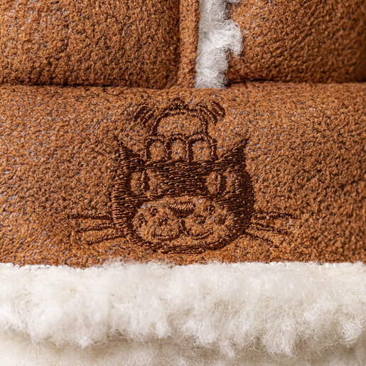 Close-up of the embroidered bear face detail on Bartholomew Bear's winter hat