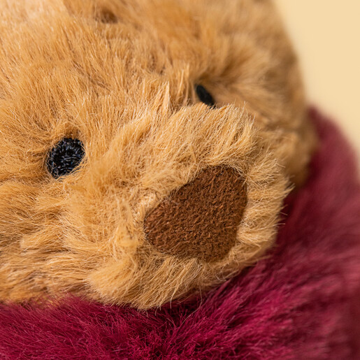 Close-up of Bartholomew Bear's soft plush face and nose
