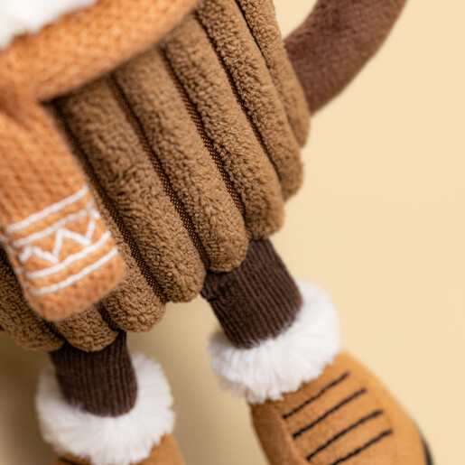 Close-up detail of the Jellycat hot chocolate plush showing textured mug and boots