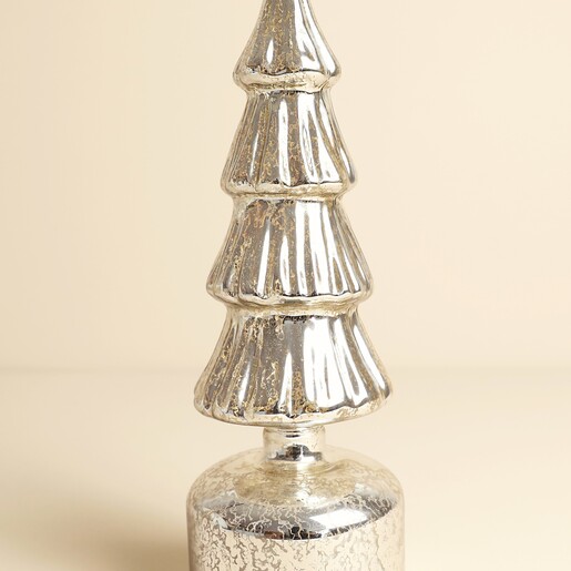 Close up of textured silver mercury glass rotating Christmas tree ornament
