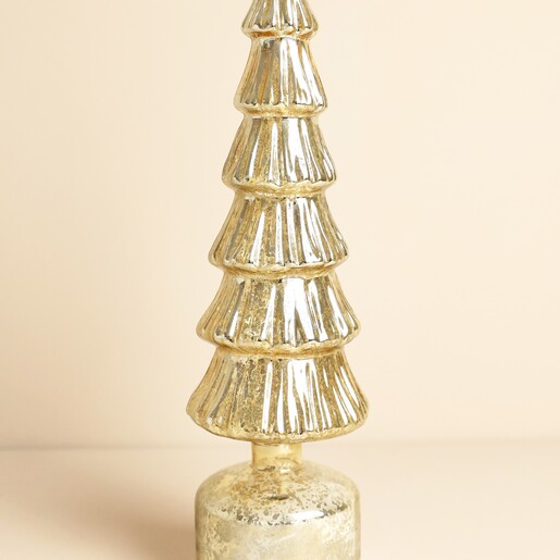 Close up view of the textured gold glass ribbed Christmas tree decoration