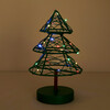 Lit green wire Christmas tree light glowing with colourful micro fairy lights