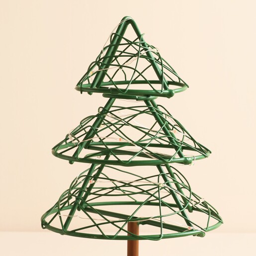 Close-up of the green wire tiers and fairy lights on the Christmas tree