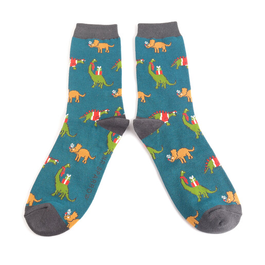 Pair of teal Christmas socks featuring colourful dinosaurs wearing festive winter accessories.