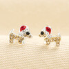 A pair of sterling silver sausage dog stud earrings with crystal Santa hats